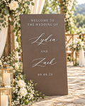 Personalized 3D layered wooden wedding welcome sign with raised white lettering displayed at an elegant outdoor wedding.
